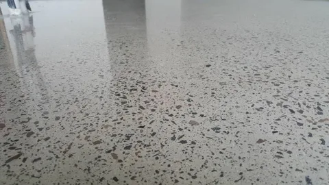 Commercial indoor floor with high reflectivity demonstrating proper polished concrete steps and finishing